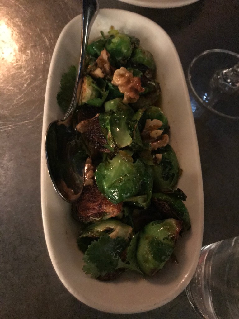 brussels sprouts and walnuts in a white dish